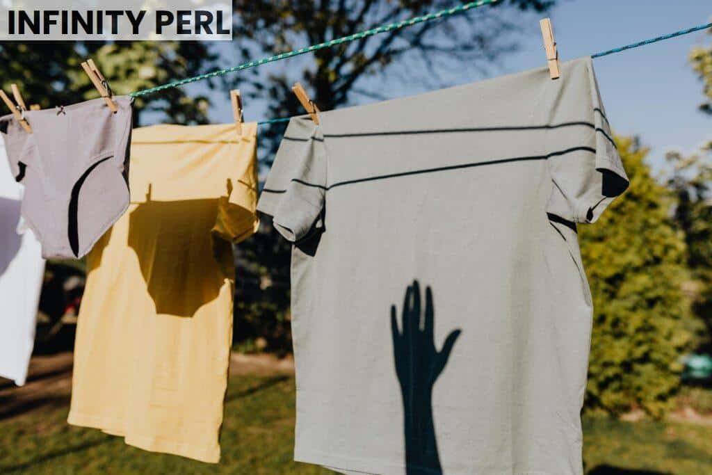 Shadows cast on clothing hanging outside on a sunny day, evoking a sense of fresh and serene rural life.