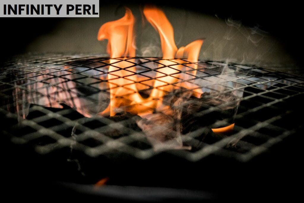Vivid flames dance over a grill, ideal for cooking concepts and barbecue themes.