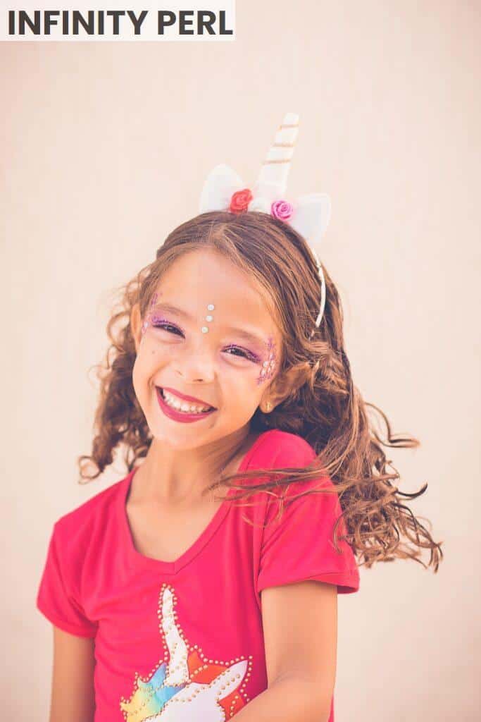 girl in pink shirt smiling
